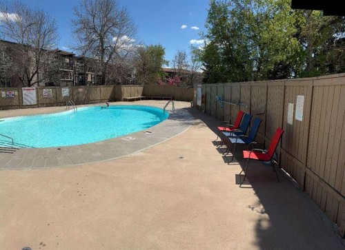 108-816 89 Avenue Sw, Calgary, AB - Outdoor With In Ground Pool With Backyard