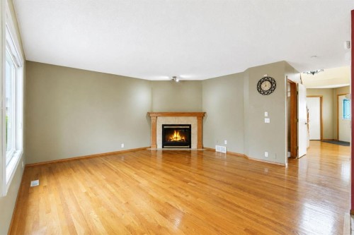 332 Harvest Hills Drive Ne, Calgary, AB - Indoor Photo Showing Living Room With Fireplace