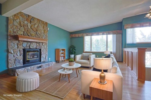 4904 Verulum Place Nw, Calgary, AB - Indoor Photo Showing Living Room With Fireplace