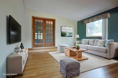 4904 Verulum Place Nw, Calgary, AB - Indoor Photo Showing Living Room