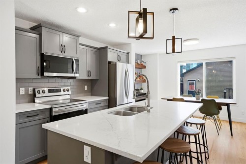 564 Evanston Drive Nw, Calgary, AB - Indoor Photo Showing Kitchen With Stainless Steel Kitchen With Double Sink With Upgraded Kitchen