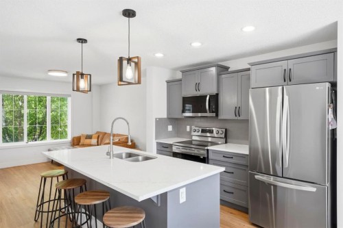 564 Evanston Drive Nw, Calgary, AB - Indoor Photo Showing Kitchen With Stainless Steel Kitchen With Double Sink With Upgraded Kitchen