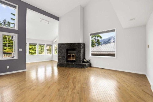 1064 Evergreen Circle, Canmore, AB - Indoor With Fireplace
