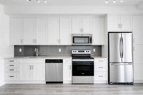 313-300 Auburn Meadows Common Se, Calgary, AB - Indoor Photo Showing Kitchen With Stainless Steel Kitchen