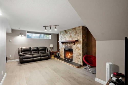 3056 32A Street Se, Calgary, AB - Indoor Photo Showing Other Room With Fireplace