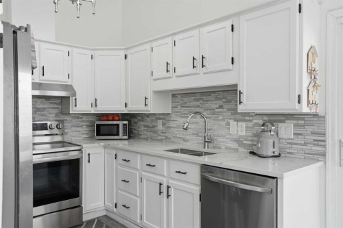 203 Shawglen Road Sw, Calgary, AB - Indoor Photo Showing Kitchen With Double Sink With Upgraded Kitchen