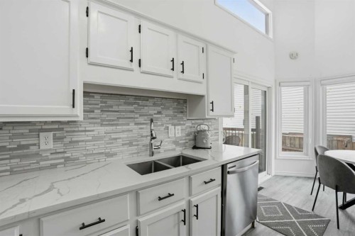 203 Shawglen Road Sw, Calgary, AB - Indoor Photo Showing Kitchen With Double Sink With Upgraded Kitchen