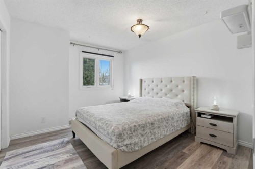 203 Shawglen Road Sw, Calgary, AB - Indoor Photo Showing Bedroom