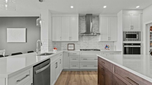 152 Threepoint Cove, Okotoks, AB - Indoor Photo Showing Kitchen With Double Sink With Upgraded Kitchen