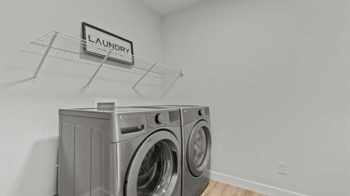 152 Threepoint Cove, Okotoks, AB - Indoor Photo Showing Laundry Room
