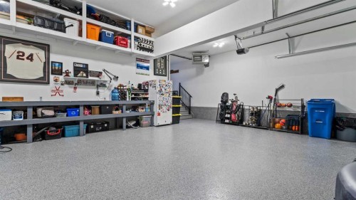 152 Threepoint Cove, Okotoks, AB - Indoor Photo Showing Garage