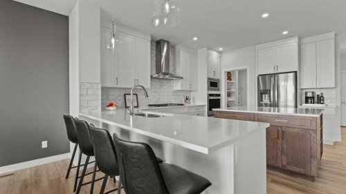 152 Threepoint Cove, Okotoks, AB - Indoor Photo Showing Kitchen With Upgraded Kitchen