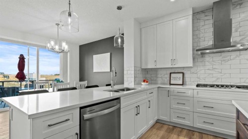 152 Threepoint Cove, Okotoks, AB - Indoor Photo Showing Kitchen With Double Sink With Upgraded Kitchen