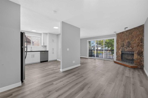 723 55 Avenue Sw, Calgary, AB - Indoor Photo Showing Living Room With Fireplace