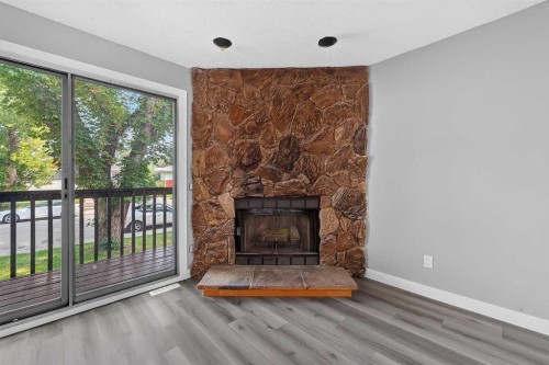 723 55 Avenue Sw, Calgary, AB - Indoor Photo Showing Living Room With Fireplace