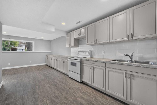 723 55 Avenue Sw, Calgary, AB - Indoor Photo Showing Kitchen With Double Sink