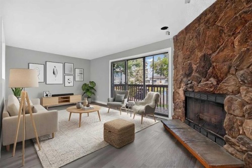 723 55 Avenue Sw, Calgary, AB - Indoor Photo Showing Living Room With Fireplace