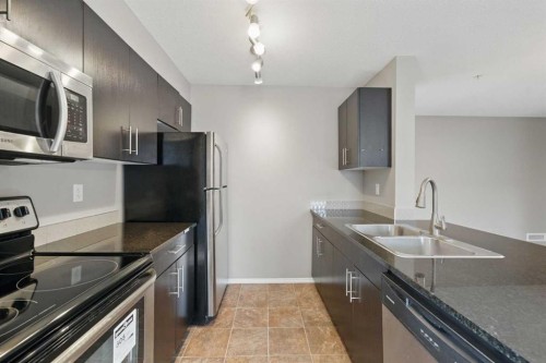 1240-81 Legacy Boulevard Se, Calgary, AB - Indoor Photo Showing Kitchen With Stainless Steel Kitchen With Double Sink With Upgraded Kitchen