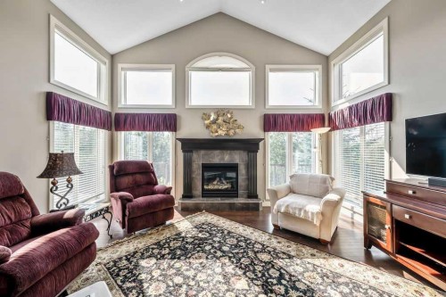 259 Willow Ridge Manor, Diamond Valley, AB - Indoor Photo Showing Living Room With Fireplace