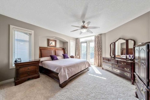 259 Willow Ridge Manor, Diamond Valley, AB - Indoor Photo Showing Bedroom