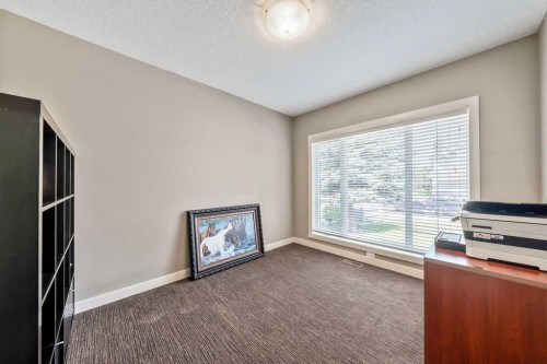259 Willow Ridge Manor, Diamond Valley, AB - Indoor With Fireplace