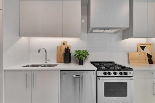 516-8230 Broadcast Avenue Sw, Calgary, AB - Indoor Photo Showing Kitchen With Double Sink