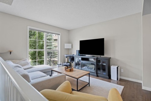 205 New Brighton Villas Se, Calgary, AB - Indoor Photo Showing Living Room