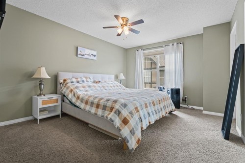205 New Brighton Villas Se, Calgary, AB - Indoor Photo Showing Bedroom