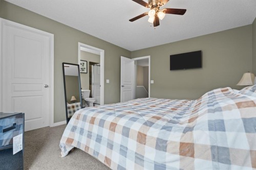 205 New Brighton Villas Se, Calgary, AB - Indoor Photo Showing Bedroom