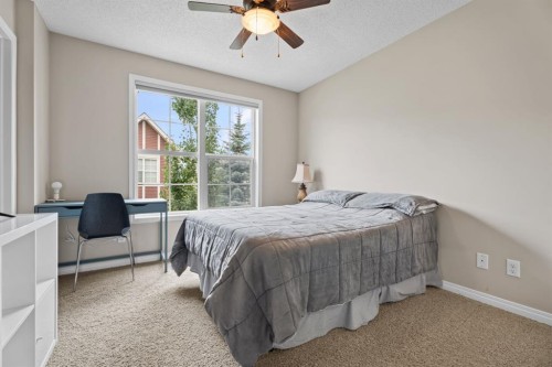 205 New Brighton Villas Se, Calgary, AB - Indoor Photo Showing Bedroom