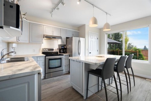 7865 24 Street Se, Calgary, AB - Indoor Photo Showing Kitchen With Stainless Steel Kitchen With Double Sink