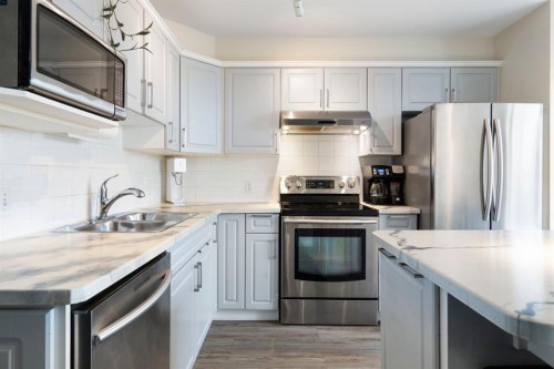7865 24 Street Se, Calgary, AB - Indoor Photo Showing Kitchen With Stainless Steel Kitchen With Double Sink With Upgraded Kitchen
