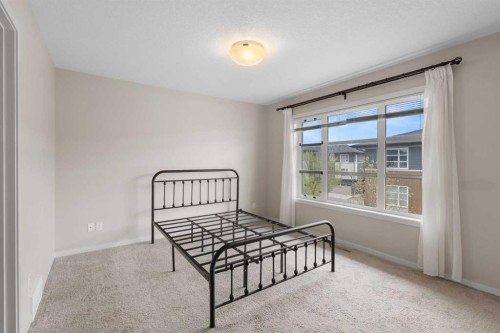 506 Evansridge Park Nw, Calgary, AB - Indoor Photo Showing Bedroom