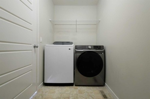506 Evansridge Park Nw, Calgary, AB - Indoor Photo Showing Laundry Room