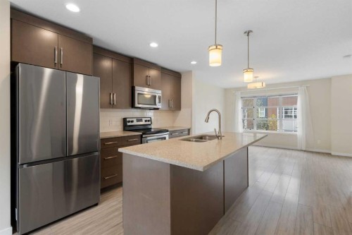 506 Evansridge Park Nw, Calgary, AB - Indoor Photo Showing Kitchen With Stainless Steel Kitchen With Double Sink With Upgraded Kitchen
