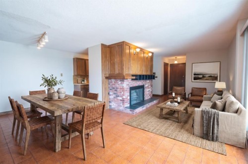 201-512 Cedar Crescent Sw, Calgary, AB - Indoor With Fireplace