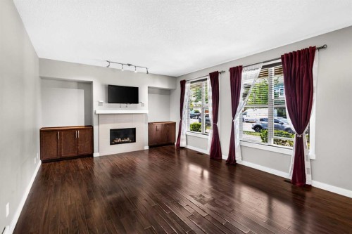 235 Mckenzie Towne Link Se, Calgary, AB - Indoor Photo Showing Living Room With Fireplace