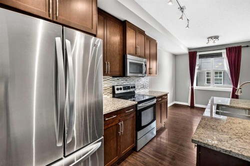 235 Mckenzie Towne Link Se, Calgary, AB - Indoor Photo Showing Kitchen With Double Sink With Upgraded Kitchen