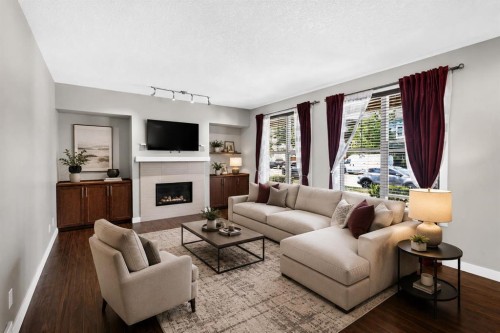 235 Mckenzie Towne Link Se, Calgary, AB - Indoor Photo Showing Living Room With Fireplace