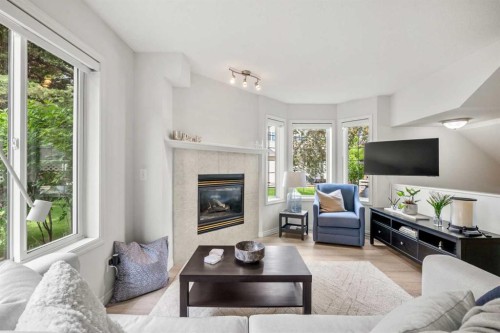 40 Chaparral Ridge Terrace Se, Calgary, AB - Indoor Photo Showing Living Room With Fireplace