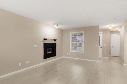 147-7707 Martha'S Haven Park Ne, Calgary, AB - Indoor Photo Showing Living Room With Fireplace
