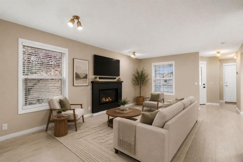 147-7707 Martha'S Haven Park Ne, Calgary, AB - Indoor Photo Showing Living Room With Fireplace