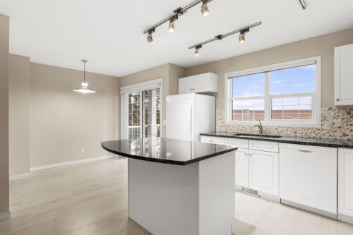 147-7707 Martha'S Haven Park Ne, Calgary, AB - Indoor Photo Showing Kitchen With Double Sink