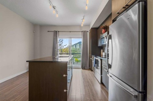 64-300 Marina Drive, Chestermere, AB - Indoor Photo Showing Kitchen With Stainless Steel Kitchen