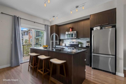 64-300 Marina Drive, Chestermere, AB - Indoor Photo Showing Kitchen With Stainless Steel Kitchen With Upgraded Kitchen