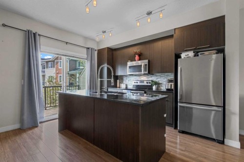 64-300 Marina Drive, Chestermere, AB - Indoor Photo Showing Kitchen With Stainless Steel Kitchen With Upgraded Kitchen