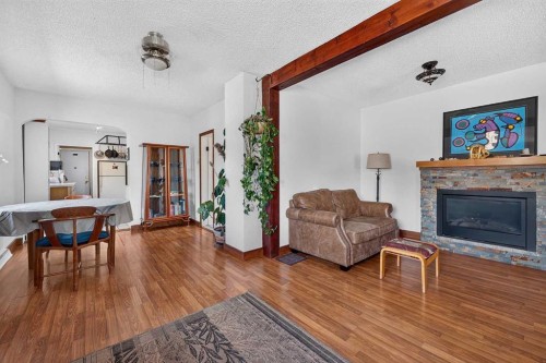 241 25 Avenue Ne, Calgary, AB - Indoor Photo Showing Living Room With Fireplace