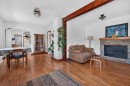 241 25 Avenue Ne, Calgary, AB  - Indoor Photo Showing Living Room With Fireplace 