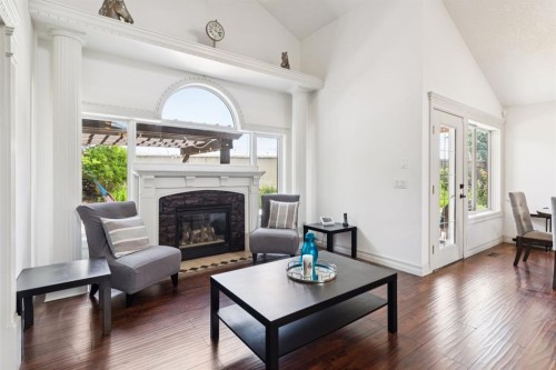 70 Discovery Ridge Court Sw, Calgary, AB - Indoor Photo Showing Living Room With Fireplace