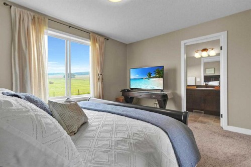 460 Seclusion Valley Drive, Diamond Valley, AB - Indoor Photo Showing Bedroom
